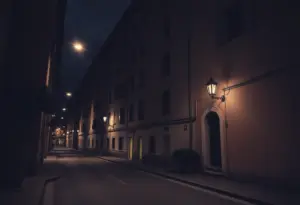 Darkened street outside an apartment in Florence highlighting community concerns about violence.