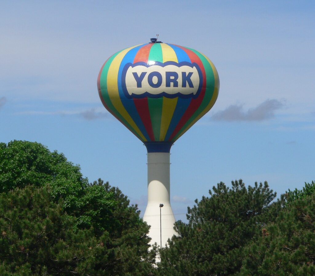 Municipal water tower against a blue sky